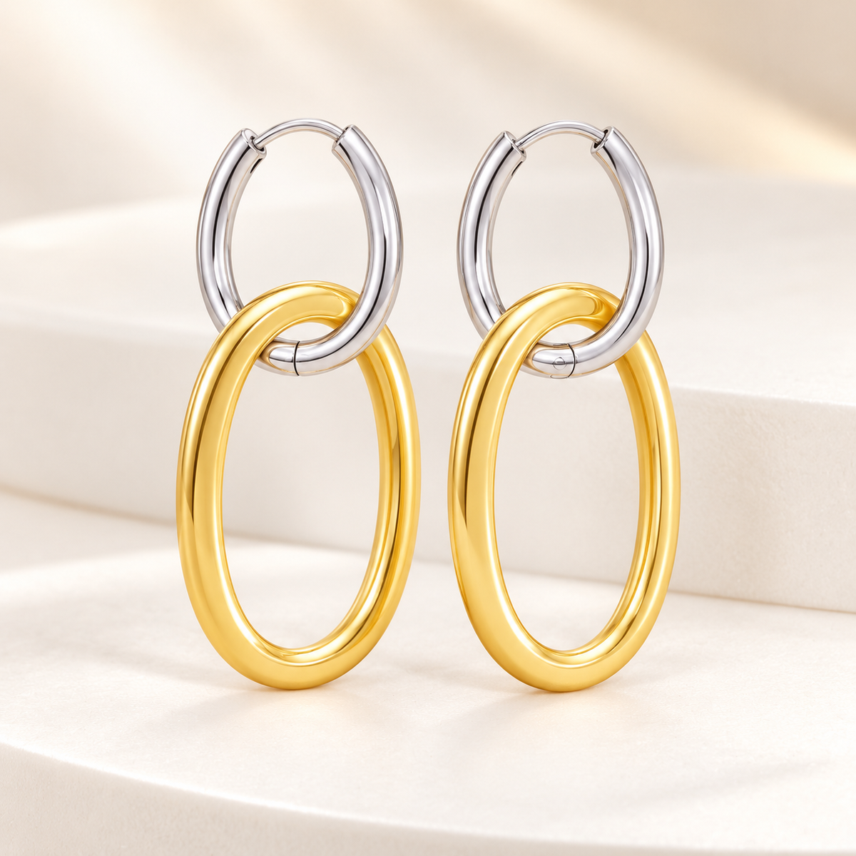Aretes Colgantes Bicolor con Aros Ovalados en Stainless Steel