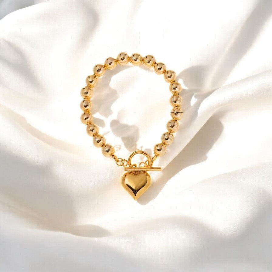 Pulsera de Esferas con Charm de Corazon en Stainless Steel Dorado