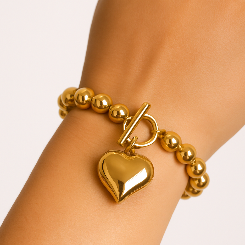 Pulsera dorada esferas con charm corazon
